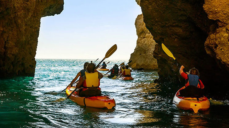 Kayakers in sea cave