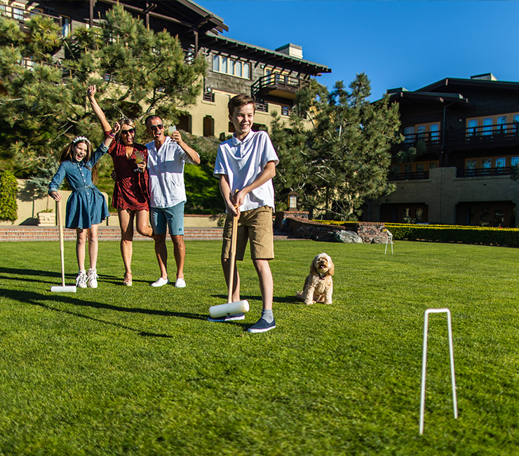 Family enjoying a round of croquet on the Arroyo Terrace