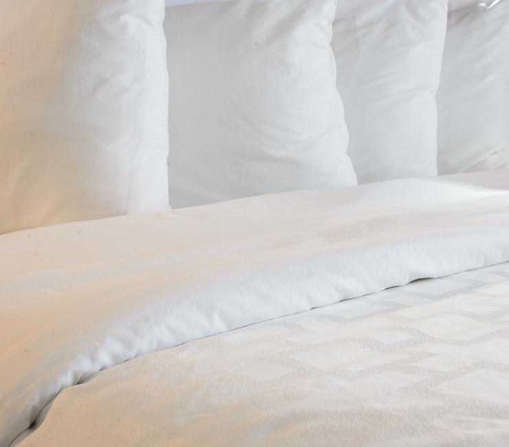 Luxurious down feather duvets and pillows are featured in the room at The Lodge at Torrey Pines.