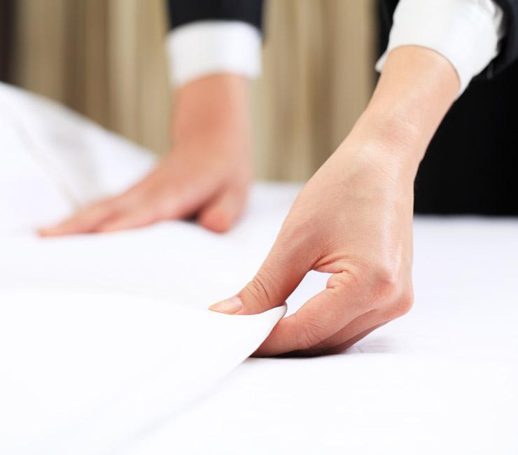 Staff preparing the rooms for guests with turndown service at The Lodge at Torrey Pines.