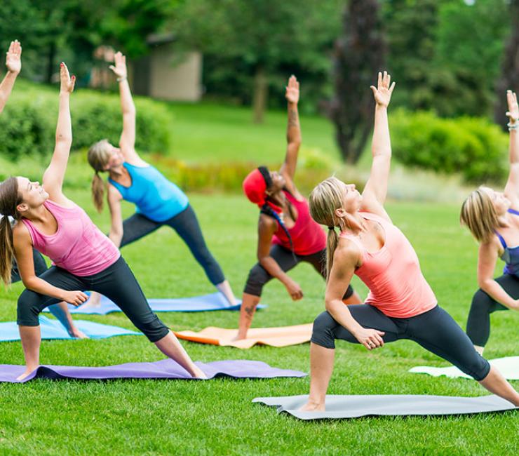 People enjoying yoga outdoors