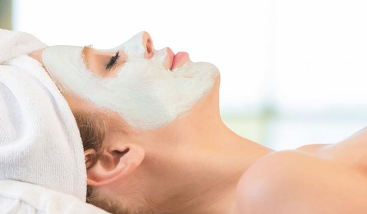 Woman enjoying facial treatment