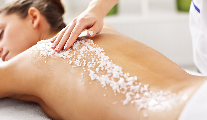 woman enjoying a spa scrub
