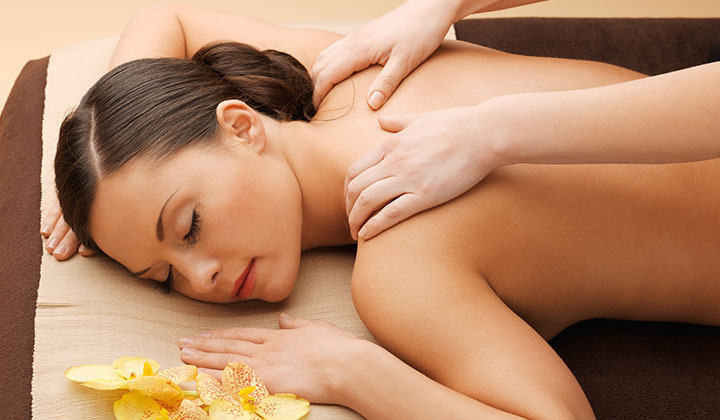 Calm beautiful woman in massage salon