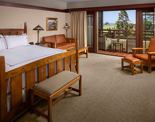 Interior of the bedroom of a Palisade Suite at The Lodge at Torrey Pines