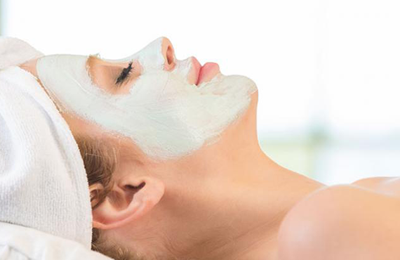 Woman enjoying facial treatment