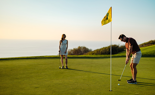 Couple golfing at the Torrey Pines Golf Course