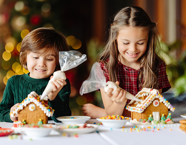 Children decorating gingerbread houses at The Lodge at Torrey Pines
