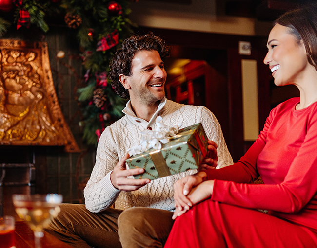 Couple enjoying holiday cocktails at the A.R. Valentien Lounge