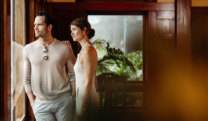 Couple gazing out of the window at The Lodge at Torrey Pines