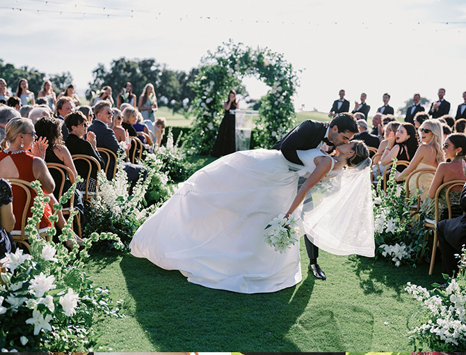 Couple sharing a kiss at the Lodge at Torrey Pines