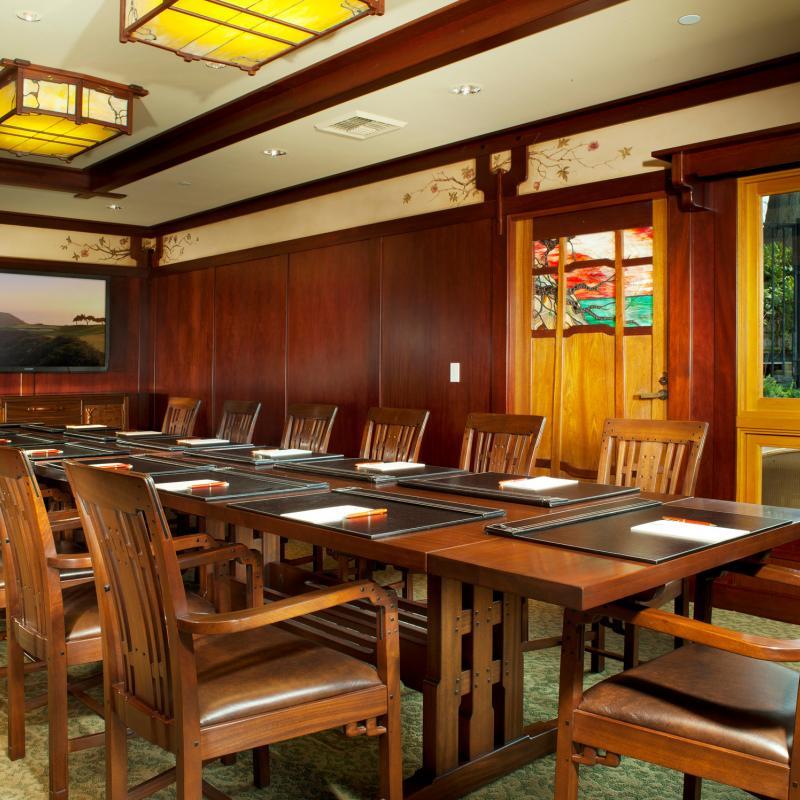 Interior of the Hughes Cottage at The Lodge at Torrey Pines set up for a boardroom style meeting.