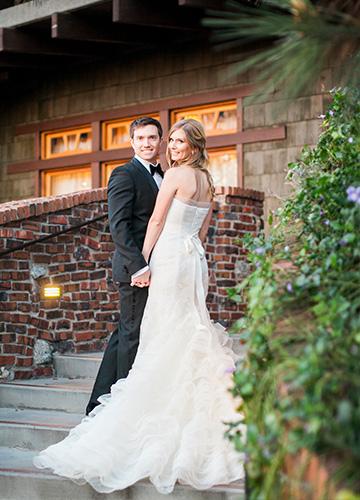 Wedding couple walking up the brick stair case at The Lodge at Torrey Pines