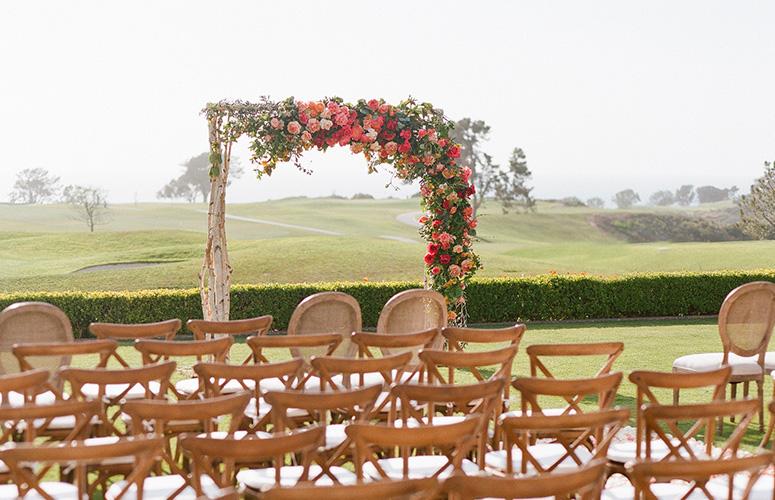 Chairs and arch set up on the Arroyo Terrace at the Lodge at Torrey Pines