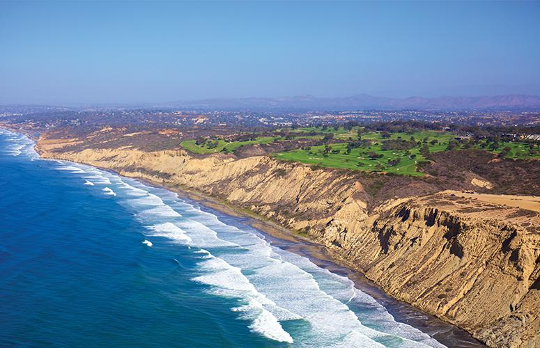 Aerial view of Torrey Pines Golf Course with views of the cliffs and the Pacific Ocean