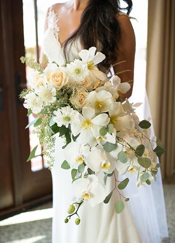 Bride holding bouquet in the suites overlooking the Torrey Pines Golf Course